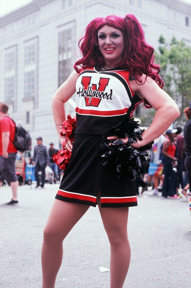 Cheerleader poses with hands on hips